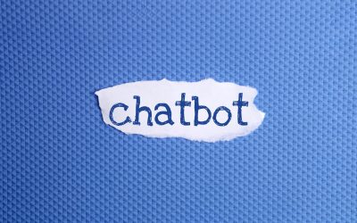 a torn paper written with inscription Chatbot on a blue background